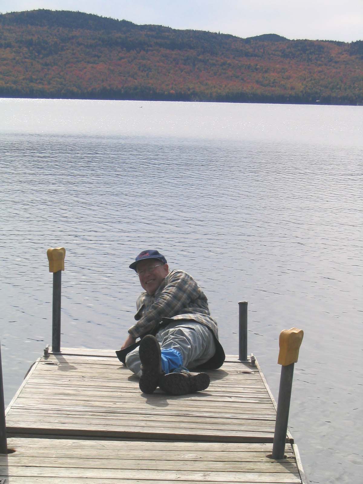 31.0 MM. Pleasant Pond, another nice Maine lake to have a picnic along the shore, take a break at or enjoy a swim in. Here I am lounging in the sun on the dock. There is easy access to here via Pleasant Pond Road and Boise-Cascade lumber road. Courtesy askus3@optonline.net